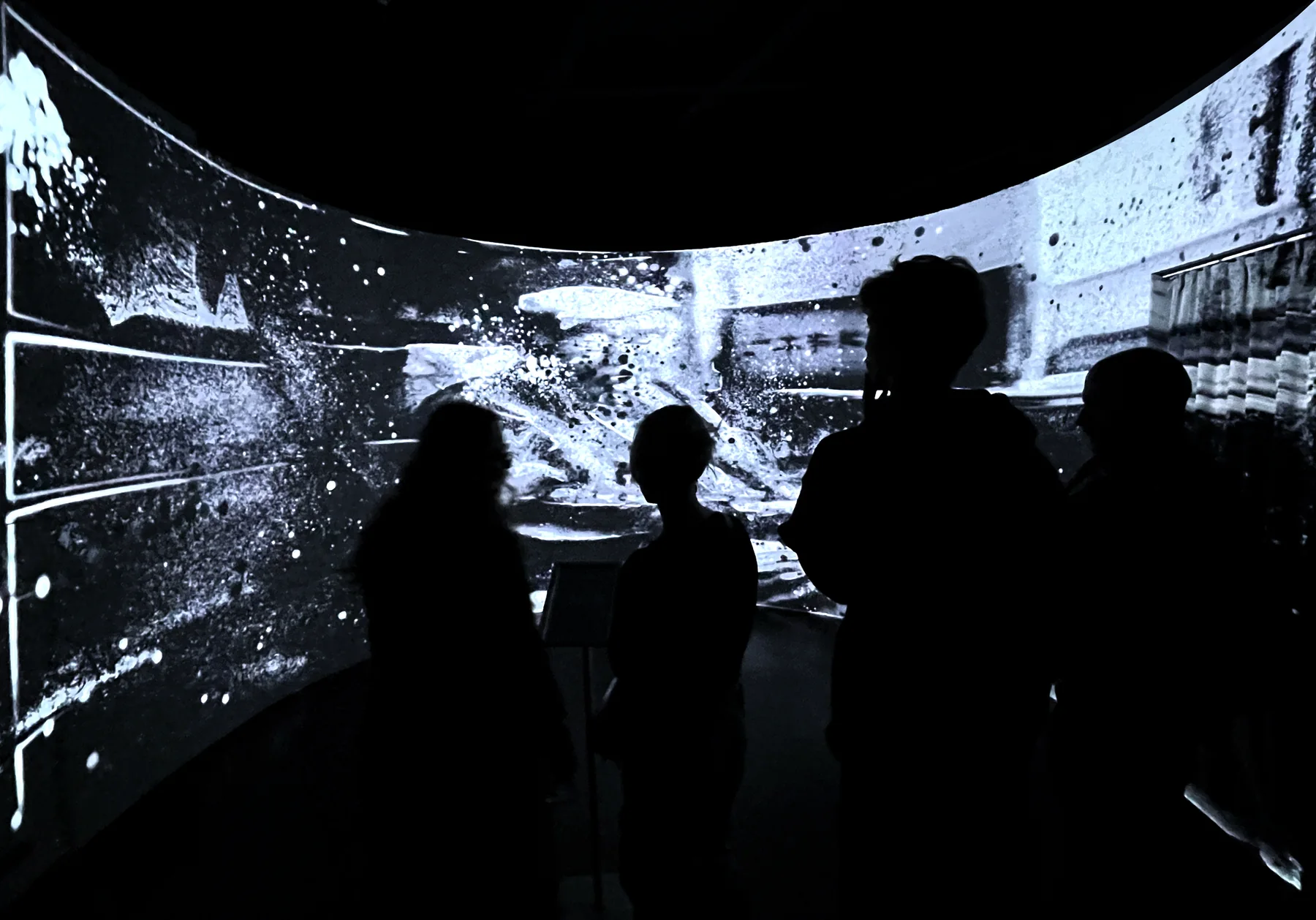 Visitors watch an immersive wall of generated memories